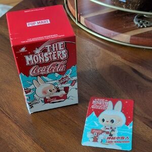 The Monsters Coca-Cola Labubu figurine. UNOPENED & AUTHENTIC - Little Snowman